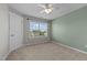 Bedroom with neutral walls, plush carpet, and a window bringing in natural light at 319 Brinkley Cir, Mebane, NC 27302