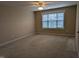 This is a simple bedroom with carpet floors and a large window letting in natural light at 319 Brinkley Cir, Mebane, NC 27302