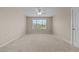 A bedroom with natural light, neutral walls, and a carpeted floor at 319 Brinkley Cir, Mebane, NC 27302