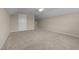 Expansive bonus room with neutral carpeting and natural light, perfect for flexible living space at 319 Brinkley Cir, Mebane, NC 27302