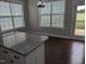Bright breakfast nook with a view of the backyard, offering a cozy spot to enjoy meals and natural light at 319 Brinkley Cir, Mebane, NC 27302