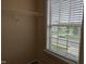 Small closet with a wire shelf and large window with natural lighting and view of the outdoors at 319 Brinkley Cir, Mebane, NC 27302