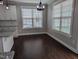 Open dining area bathed in natural light from large windows, enhancing the space's inviting ambiance, perfect for meals at 319 Brinkley Cir, Mebane, NC 27302