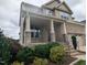 Beautifully landscaped front yard, a brick exterior, and a two-car garage creating a welcoming and stylish facade at 319 Brinkley Cir, Mebane, NC 27302
