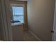 Laundry room with tile flooring, washer, and a window letting in natural lighting at 319 Brinkley Cir, Mebane, NC 27302