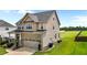 Spacious home exterior featuring a well-maintained lawn and a two-car garage at 319 Brinkley Cir, Mebane, NC 27302