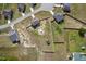 Aerial view showcases fenced yard, above ground pool, and shed within a residential neighborhood at 328 Avery Meadows Dr, Smithfield, NC 27577
