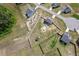 An aerial showcases the home with a fenced-in yard, pool and shed in a residential area at 328 Avery Meadows Dr, Smithfield, NC 27577