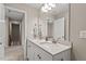 Bathroom with a double sink vanity, a large mirror, and access to the hallway at 328 Avery Meadows Dr, Smithfield, NC 27577