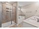 Bathroom featuring double sinks, a soaking tub, and a glass-enclosed shower at 328 Avery Meadows Dr, Smithfield, NC 27577