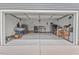 Spacious two-car garage with ample room for parking and storage, plus workbench and shelving at 328 Avery Meadows Dr, Smithfield, NC 27577