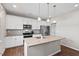 Modern kitchen with stainless steel appliances, granite countertops, and white cabinetry at 328 Avery Meadows Dr, Smithfield, NC 27577