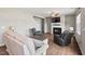 Comfortable living room with a fireplace, large windows, and cozy seating area at 328 Avery Meadows Dr, Smithfield, NC 27577
