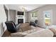 Inviting living room has a fireplace, large windows, and cozy seating at 328 Avery Meadows Dr, Smithfield, NC 27577