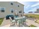 Beautiful backyard patio featuring outdoor seating, a dining area, and a grill at 328 Avery Meadows Dr, Smithfield, NC 27577