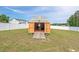 Shed with open doors, and a ramp, revealing ample storage space for tools and equipment at 328 Avery Meadows Dr, Smithfield, NC 27577