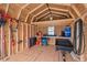Neat shed interior with storage shelves, gardening tools, and natural light at 328 Avery Meadows Dr, Smithfield, NC 27577