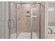 Stylish glass-enclosed shower with tiled walls and built-in shelving niches at 328 Avery Meadows Dr, Smithfield, NC 27577