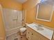 Bathroom with a vanity, commode, and shower-tub combo; needs repair at 3559 Mill Run, Raleigh, NC 27612