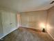 A primary bedroom with closet and adjoining bathroom doorway at 3559 Mill Run, Raleigh, NC 27612