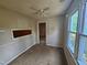 Dining room featuring neutral tones, ceiling fan and natural light from the large window at 3559 Mill Run, Raleigh, NC 27612