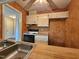 View of the kitchen featuring a stove and classic cabinetry at 3559 Mill Run, Raleigh, NC 27612