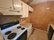 A kitchen featuring white appliances, wood countertops, and stained tile flooring at 3559 Mill Run, Raleigh, NC 27612