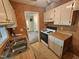 Functional kitchen featuring white cabinetry, laminate countertops, double bowl sink, and standard appliances at 3559 Mill Run, Raleigh, NC 27612