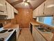 Kitchen featuring a ceiling fan, white cabinets and appliances, and wood countertops at 3559 Mill Run, Raleigh, NC 27612