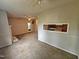 Spacious living room featuring neutral tones, ceiling fan and a pass through to the kitchen at 3559 Mill Run, Raleigh, NC 27612