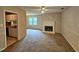 Living room with brick fireplace, carpet, ceiling fan, and open to other rooms at 3559 Mill Run, Raleigh, NC 27612