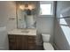 Contemporary bathroom with a large mirror, elegant vanity, and modern fixtures at 3632 Rail Overlook Dr, New Hill, NC 27562