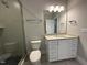 Well-lit bathroom featuring a walk-in shower and stylish vanity at 3632 Rail Overlook Dr, New Hill, NC 27562