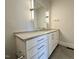 Bathroom boasts a modern vanity with sleek drawers, elegant fixtures, and a large mirror at 3632 Rail Overlook Dr, New Hill, NC 27562