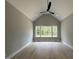 Spacious bedroom featuring a vaulted ceiling, recessed lighting, and a large window with a view at 3632 Rail Overlook Dr, New Hill, NC 27562