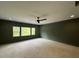 Spacious bedroom with natural light features neutral walls and a modern ceiling fan at 3632 Rail Overlook Dr, New Hill, NC 27562