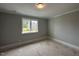 Bright bedroom with a window, offering scenic views and ample natural light at 3632 Rail Overlook Dr, New Hill, NC 27562