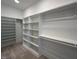 Spacious walk-in closet featuring custom shelving and ample storage space for an organized wardrobe at 3632 Rail Overlook Dr, New Hill, NC 27562