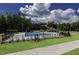 Community pool with plenty of lounge seating and umbrellas, perfect for summertime enjoyment and relaxation at 3632 Rail Overlook Dr, New Hill, NC 27562