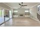 Open living room with a fireplace, built-in shelving, and sliding doors to the outdoor deck at 3632 Rail Overlook Dr, New Hill, NC 27562