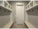 Functional mudroom with built-in cubbies, benches, and hooks for organizing belongings at 3632 Rail Overlook Dr, New Hill, NC 27562