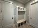 Charming mudroom with built-in bench, hooks, cubbies, and convenient storage solutions at 3632 Rail Overlook Dr, New Hill, NC 27562