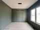 Modern office with decorative wall paneling, sleek lighting, and a large window at 3632 Rail Overlook Dr, New Hill, NC 27562