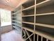 Spacious pantry with custom shelving for organized storage and easy access to kitchen necessities at 3632 Rail Overlook Dr, New Hill, NC 27562