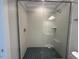 Clean and modern shower with sleek tile and a frameless glass door at 3632 Rail Overlook Dr, New Hill, NC 27562
