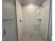 Modern walk-in shower featuring sleek tile work and glass enclosure at 3632 Rail Overlook Dr, New Hill, NC 27562