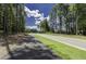 Community street with sidewalks and lush greenery provides a safe and welcoming environment at 3632 Rail Overlook Dr, New Hill, NC 27562