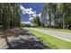 Community street with sidewalks and lush greenery provides a safe and welcoming environment at 3632 Rail Overlook Dr, New Hill, NC 27562