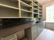 Craft room with plentiful cabinets, counter space and stylish backsplash for all of your projects at 3632 Rail Overlook Dr, New Hill, NC 27562
