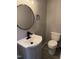Powder room with modern sink and toilet at 3825 Old Coach Rd, Raleigh, NC 27616